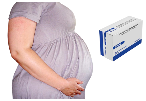 Pregnant woman with a box of tablets